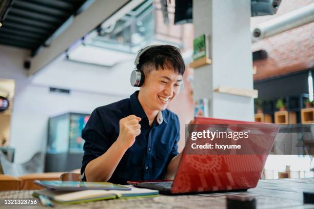 Man Excited Laptop Photos and Premium High Res Pictures - Getty Images