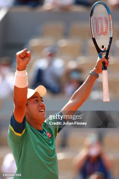 Kei Nishikori of Japan celebrates winning his mens second round match against Karen Khachanov of Russia during day four of the 2021 French Open at...