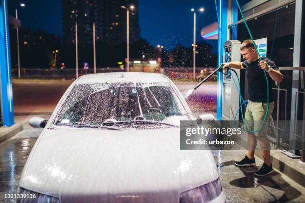 self service car wash - close up of a cleansing spray nozzle stock pictures, royalty-free photos & images