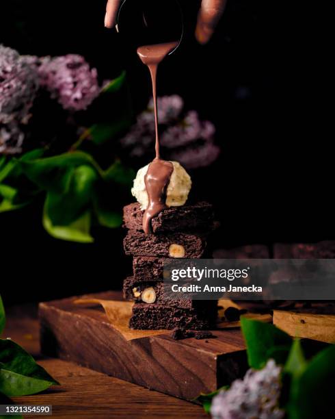 brownie with ice cream - fudge sauce stock pictures, royalty-free photos & images