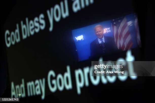 President Joe Biden speaks as his image is reflected on a teleprompter during an event in the South Court Auditorium of the White House June 2, 2021...