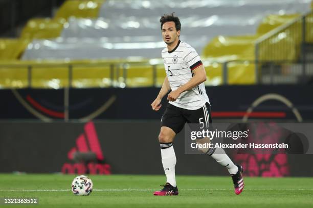 Mats Hummels of Germany runs with the ball during the international friendly match between Germany and Denmark at Tivoli Stadion on June 02, 2021 in...