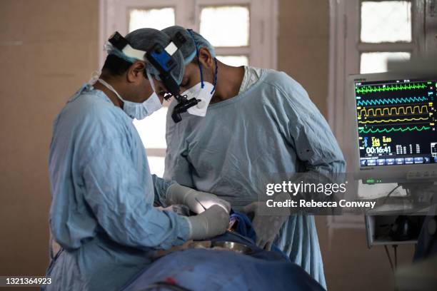 Members of an Indian surgical team perform an endoscopic surgery to remove a fungal infection from a patient suffering from mucormycosis at the...