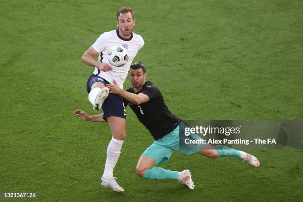 Harry Kane of England is challenged by Aleksander Dragovic of Austria during the international friendly match between England and Austria at...