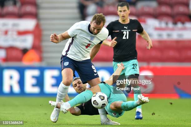 Harry Kane of England is challenged by Aleksander Dragovic of Austria during the international friendly match between England and Austria at...