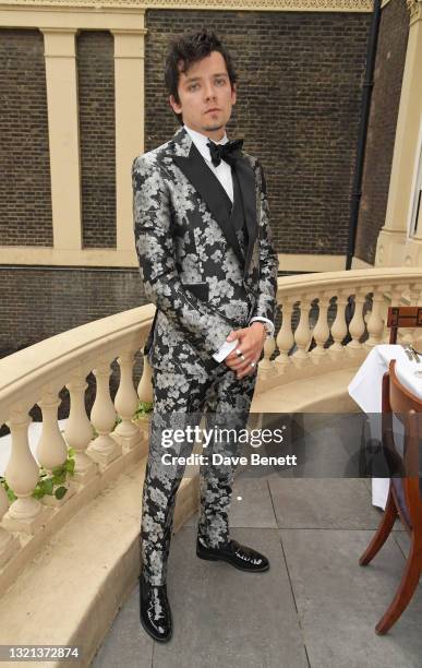 Asa Butterfield attends Joshua Kane's ambassador dinner in partnership with Victoria The App, showcasing his summer collection at Home House on June...
