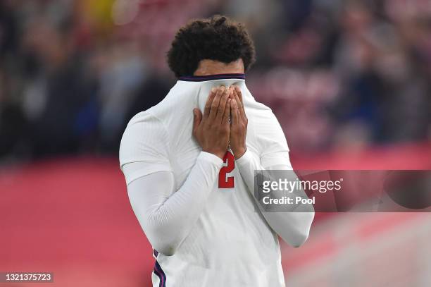 Trent Alexander-Arnold of England reacts after picking up an injury during the international friendly match between England and Austria at Riverside...