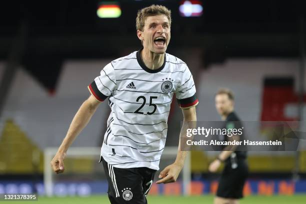 Thomas Muller of Germany celebrates their side's first goal scored by Florian Neuhaus of Germany during the international friendly match between...