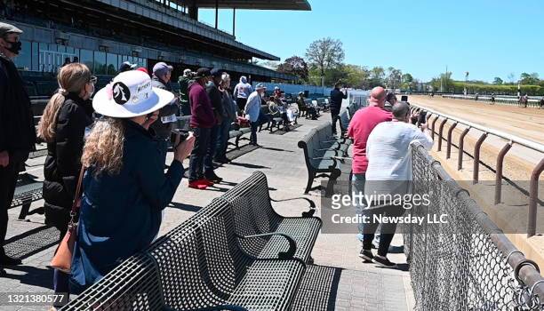 It's the first day that racing fans are allowed back at Belmont Park in Elmont, New York, because of Covid-19, albeit with limited capacity and...