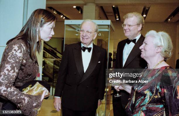 Wendy Deng stands next to her husband Sir Rupert Murdoch, Chairman and CEO of News Corp, Sir Howard Stringer, CEO of Sony America, and P.D. James,...