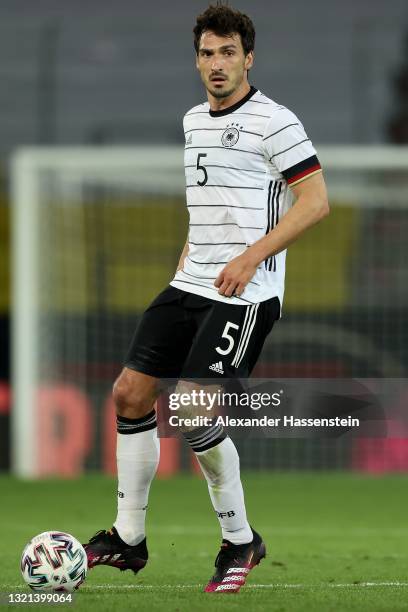 Mats Hummels of Germany runs with the ball during the international friendly match between Germany and Denmark at Tivoli Stadion on June 02, 2021 in...