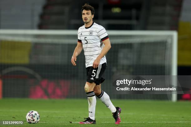 Mats Hummels of Germany runs with the ball during the international friendly match between Germany and Denmark at Tivoli Stadion on June 02, 2021 in...