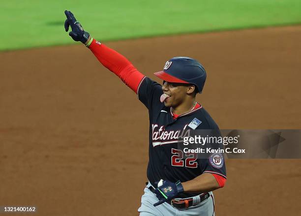 Juan Soto of the Washington Nationals reacts after hitting a two-run homer in the fifth inning against the Atlanta Braves at Truist Park on June 02,...