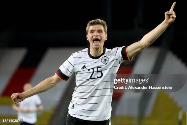 Thomas Muller of Germany celebrates their side's first goal scored by Florian Neuhaus of Germany during the international friendly match between...