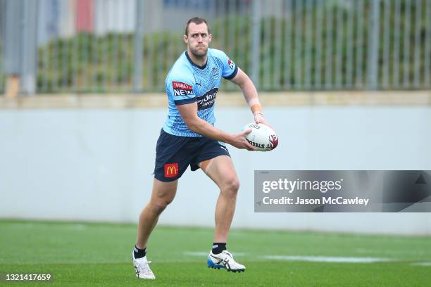 Isaah Yeo passes during a New South Wales Blues State of Origin training session at NSWRL Centre of Excellence on June 03, 2021 in Sydney, Australia.