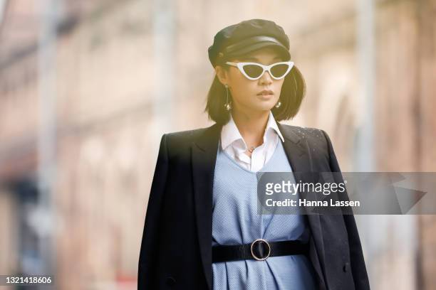 Christine Ai wearng Tom Ford shirt, Oddeh dress, sunglasses Celine, Prada bag Yves Saint Laurent jacket and hat and By Far boots at Afterpay...