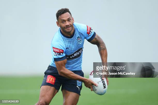 Apisai Koroisau passes during a New South Wales Blues State of Origin training session at NSWRL Centre of Excellence on June 03, 2021 in Sydney,...