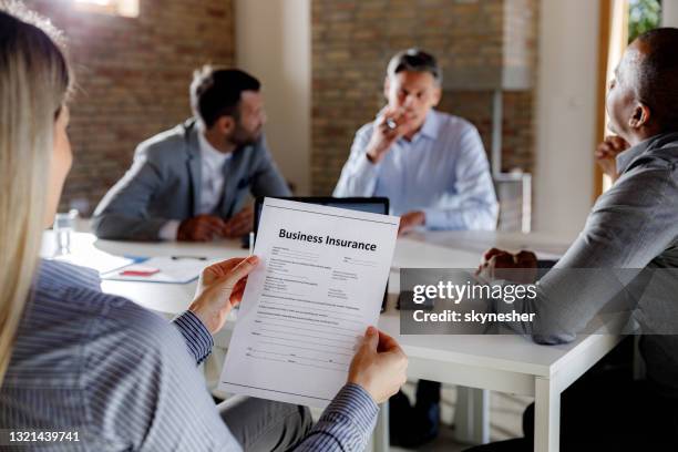 working on business insurance application form! - application form stock pictures, royalty-free photos & images