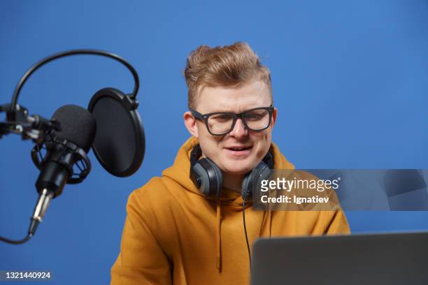 a vlogger in his recording studio.  stock photo - television host stock pictures, royalty-free photos & images