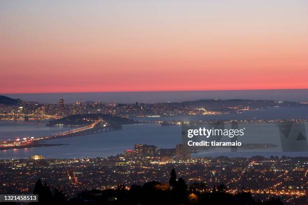 aerial view of oakland and san francisco bay at sunset, san francisco bay area, california, usa - oakland california stock pictures, royalty-free photos & images
