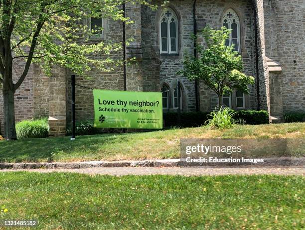 Love thy neighbor, schedule thy vaccination, sign outside church, Greenwich, CT.