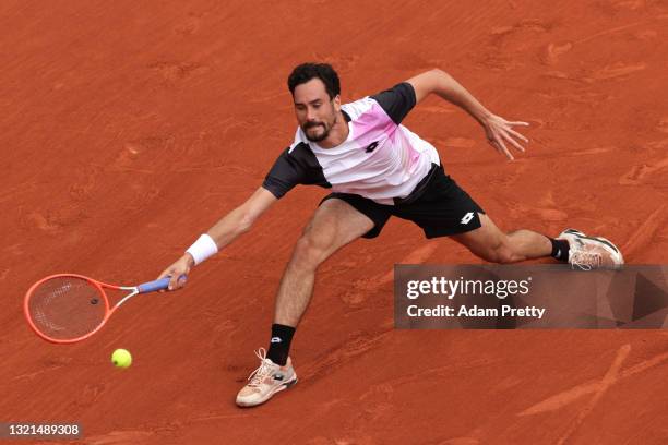 Gianluca Mager of Italy plays a forehand during his mens second round match against Jannik Sinner of Italy during day five of the 2021 French Open at...