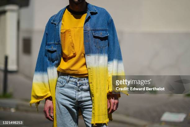 Anthony Etcheverry, aka hair stylist Monsieur Anthony @monsieur_anthony_paris, wears a yellow t-shirt, a yellow with black collar pullover with large...