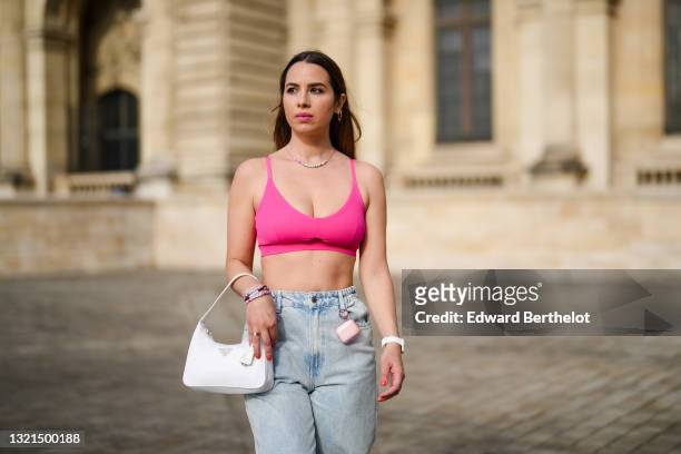 Maria Rosaria Rizzo @lacoquetteitalienne wears gold earrings, a multicolor Love slogan necklace, a pink fushcia bra underwear from Pimkie, blue faded...