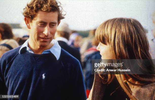 Prince Charles, Prince of Wales, wearing a navy blue Ralph Lauren jumper, speaks to his girlfriend Lady Jane Wellesley at Windsor Great Park circa...