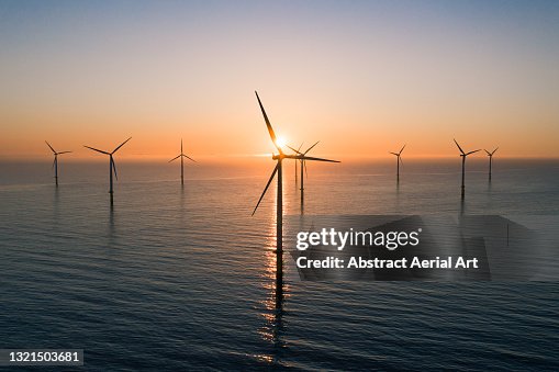 Offshore wind turbines at sunrise seen from an aerial point of view, Redcar, England, United Kingdom Offshore wind turbines at sunrise seen from an aerial point of view, Redcar, England, United Kingdom