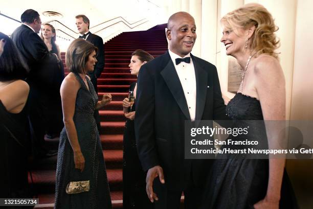 Jpg San Francisco Symphony opening night gala at Davies Symphony Hall. Ronnie Lott and Jan Harris . Ronnie Lott's wife, Karen Lott, at left with...