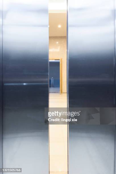 elevator door about to close - lobby closed fotografías e imágenes de stock