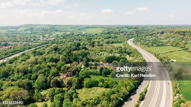 an aerial daytime view of a uk motorway - stock photo - surrey england stock pictures, royalty-free photos & images