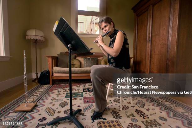 MTT_LH_023jpeg.JPG Cathy Payne, the SF Symhony's piccolo player, at home in advance of her first big solo turn. Shot in San Francisco on...