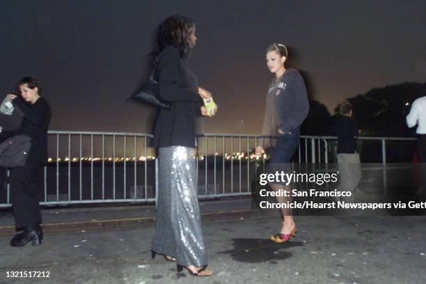 PASSPORT16b-C-14SEP00-DD-LH--Ayanna Jenkins takes a break with model friend Amanda Tosch outside while talking about runway directions. BY LIZ...