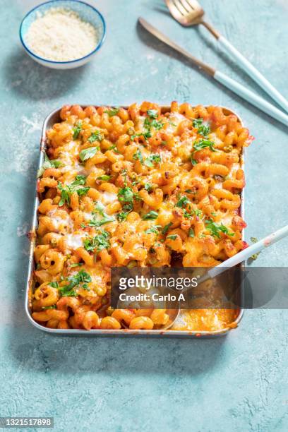 pasta baked in tomato sauce - macaroni stock pictures, royalty-free photos & images