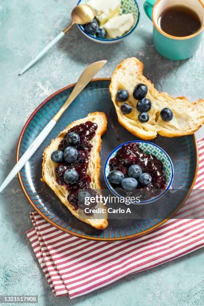 croissant with blueberry jam - croissant jam stock pictures, royalty-free photos & images