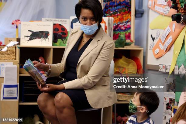Mayor Muriel Bowser reads to a group of school children at the Stevens Early Learning Center on June 03, 2021 in Washington, DC. Bowser spoke at a...