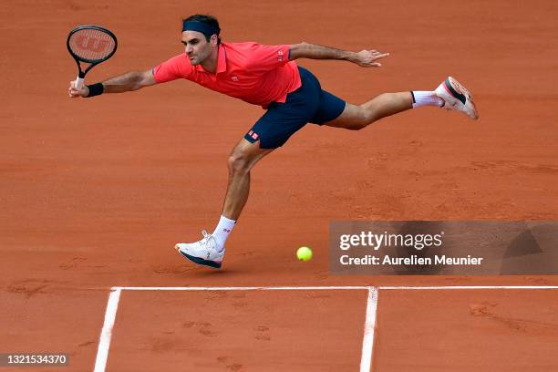 Roger Federer of Switzerland plays a forehand during his mens second round match against Marin Cilic of Croatia during day five of the 2021 French...