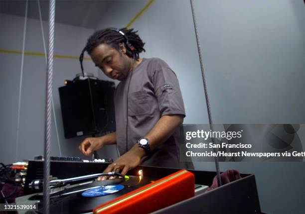 Monty Luke, who works at search engine AskJeeves, spinning albums DJ'ing for a nightclub at 836 Geary. PHOTO BY LIZ HAFALIA/CHRONICLE