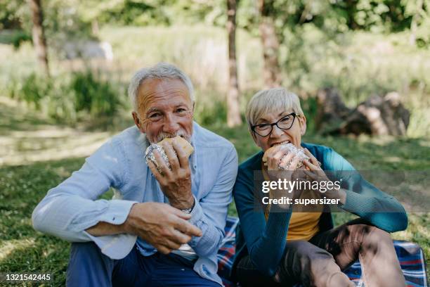 senior couple on the picnic - husband stock pictures, royalty-free photos & images