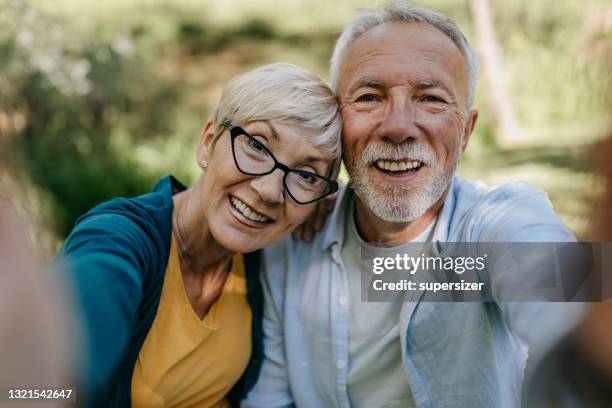 senior couple on the picnic - food joy stock pictures, royalty-free photos & images