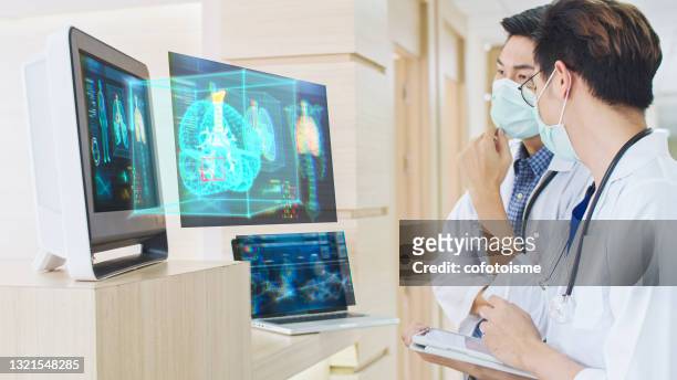 doctor discussing with modern medical graphical user interface hologram - human lung stock pictures, royalty-free photos & images