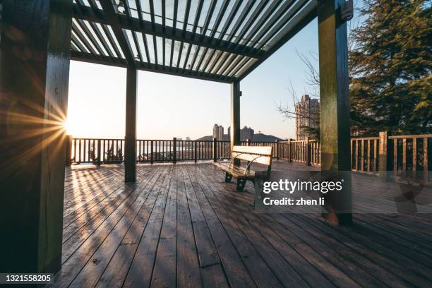 rest area in the park at sunset - pavilion stock pictures, royalty-free photos & images