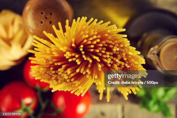 close-up of yellow pasta shot from above - dry pasta stock pictures, royalty-free photos & images