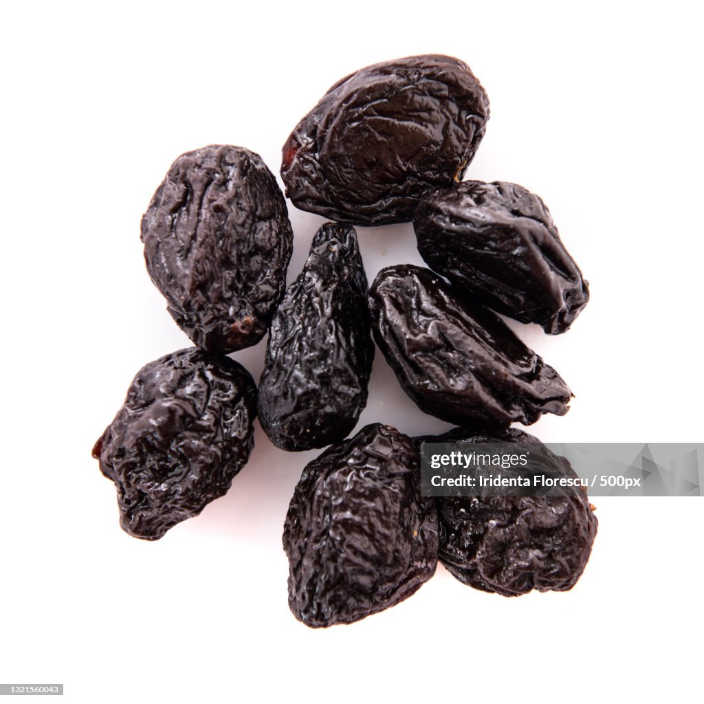 Close-up of raisins against white background
