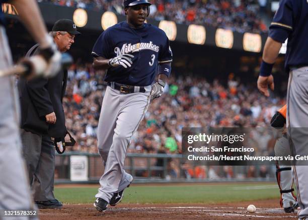 Milwaukee Brewers vs. SF Giants at AT&T Park in San Francisco, Calif., Brewer's Yuniesky Betancourt makes home plate as Giant's catcher Eli Whiteside...