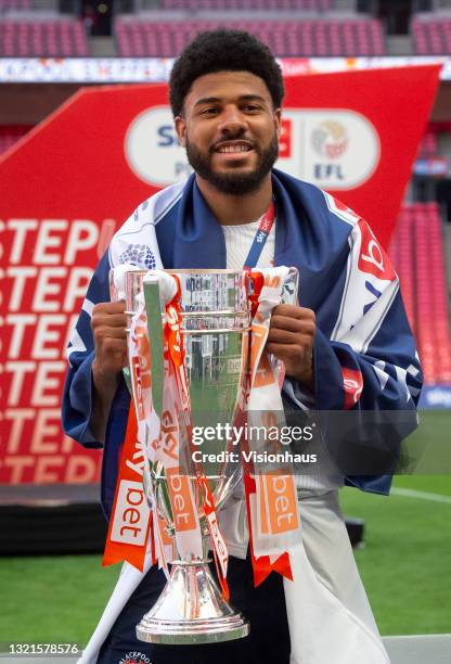 Ellis Simms of Blackpool with the trophy after winning the Sky Bet League One Play-off Final match between Blackpool and Lincoln City at Wembley...