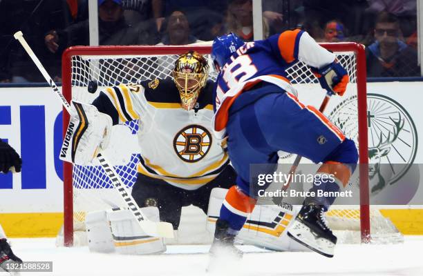 Tuukka Rask of the Boston Bruins makes the first period save on Anthony Beauvillier of the New York Islanders in Game Three of the Second Round of...