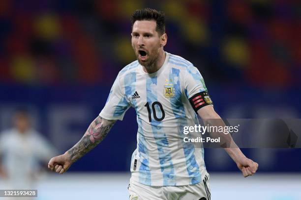 Lionel Messi of Argentina celebrates after scoring the opening goal of his team with a penalty kick during a match between Argentina and Chile as...